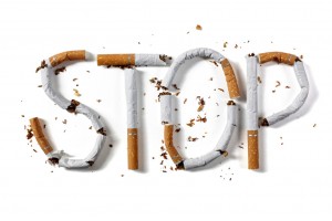 Stop smoking word written with broken cigarette concept for quitting smoking